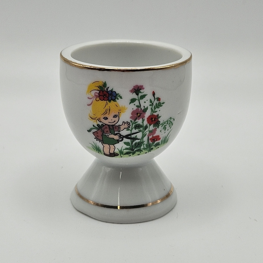 VINTAGE White Porcelain Egg Cup Girl Gardening Gold Trim Detail